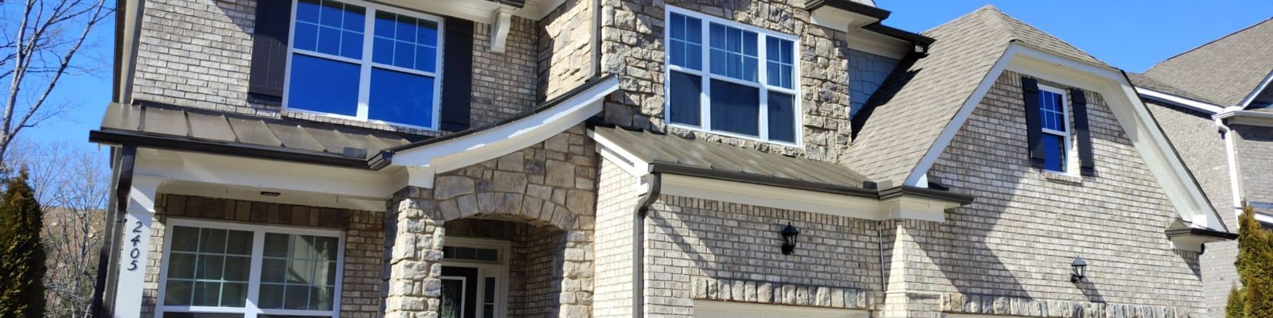 Exterior of a freshly painted stone and brick home in Georgia