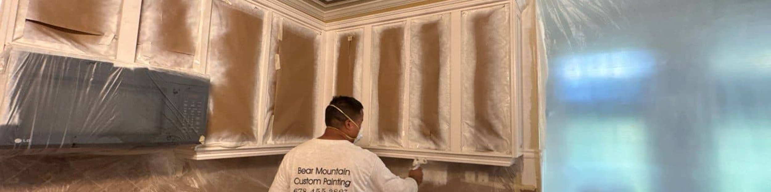 Bear Mountain Painting professional spray-painting kitchen cabinets