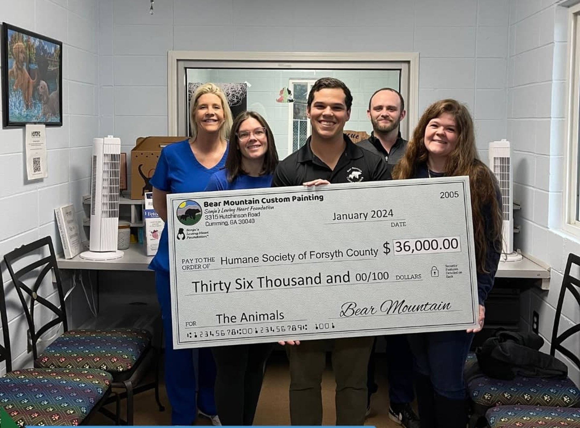 Bear Mountain team presenting $36,000 donation check to the Humane Society of Forsyth County