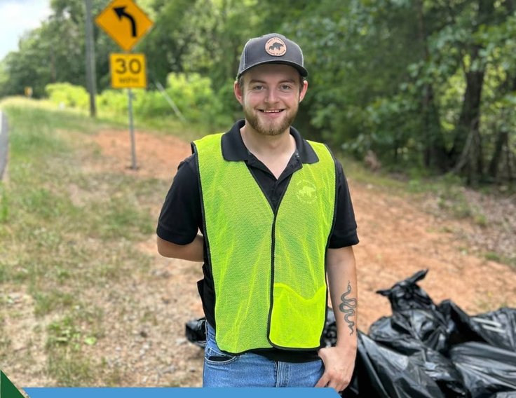 Bear Mountain Painting team member participating in Adopt A Road clean-up event
