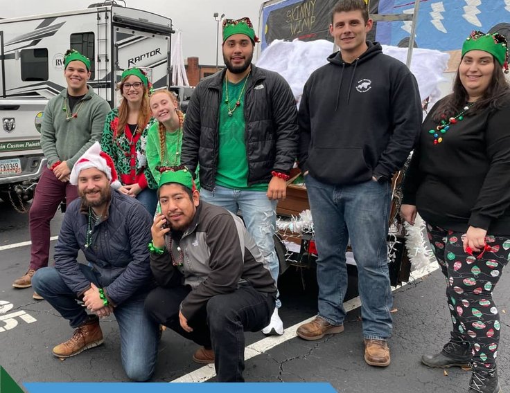 Bear Mountain Painting team in holiday costumes at the Cumming Christmas Parade