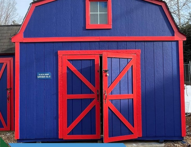 Blue and red barn painted by Bear Mountain Painting for the Humane Society of Forsyth County