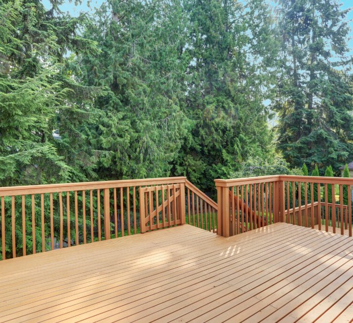 Deck and fence painting project by Bear Mountain Painting
