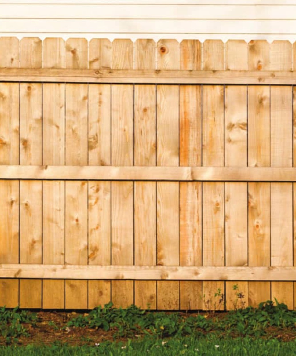 Freshly installed wood fence surrounding a Georgia home property